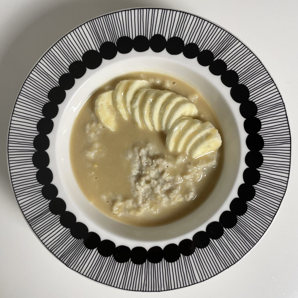 Creamy oatmeal with banana and sweet peanut butter sauce